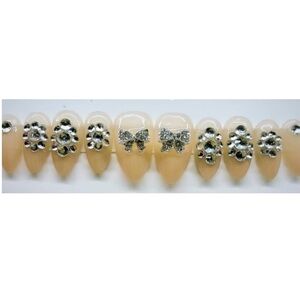 Elegant Cream Nail Art with Silver Accents